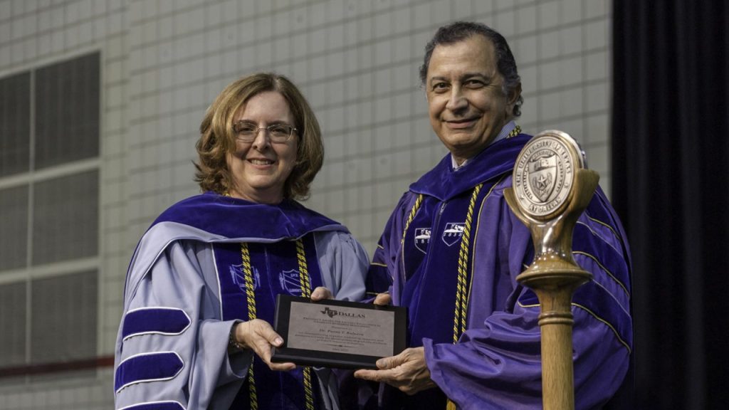 Dr. Poras T. Balsara receives the Provost's Award for Faculty Excellence in Graduate Research Mentoring from Provost Inga Musselman.
