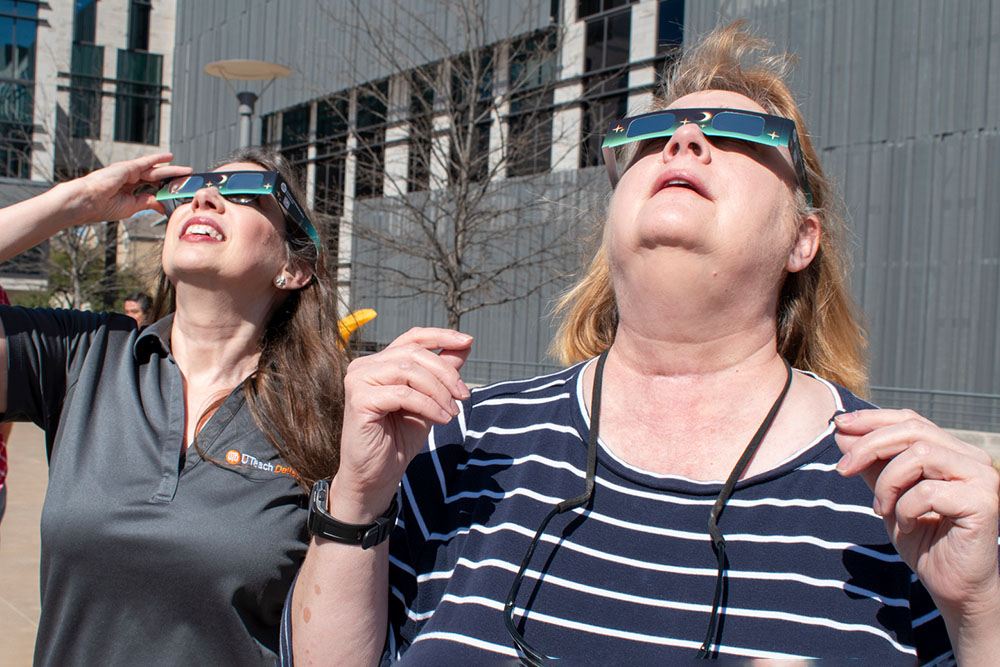 Dr. Mary Urquhart and Centerville Elementary School fifth grade teacher Amy Angel practice safe viewing of the sun.